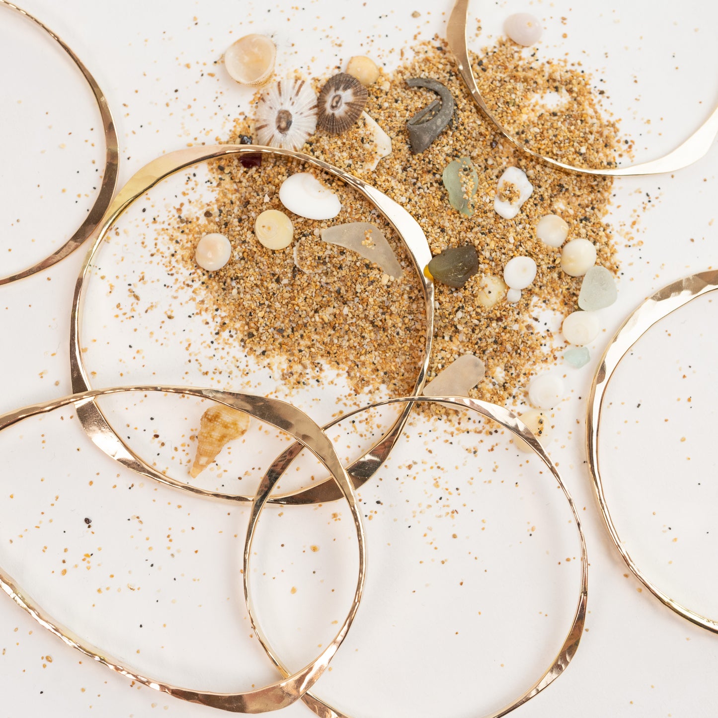 Bangle Bracelets in 14K Solid Yellow Gold. Three forged styles: Three Way, Four Way and Oval. Light 12 gauge and Heavy 8 gauge